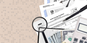 Financial documents and money representing budgeting for studying abroad